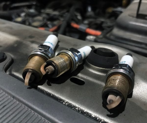 Tune ups used to involve replacing parts, such as spark plugs, spark plug wires, and the distributor cap and rotor. Mechanics would change the air filter and fuel filter, replace points in the condenser – if the car was old enough – and even perform an oil change, depending on the time frame. It could also consist of adjusting the distributor to change the timing, cleaning the throttle plate and the choke on the carburetor, and making air fuel adjustments, including setting the base idol. Through the years, as vehicles have become more advanced with fuel injections and computers, what is considered a tune up has changed. Changing the spark plugs is one service that continues to be offered. However, the mileage between spark plugs has gone from 30,000 miles to between 60,000 and 105,000 miles in most vehicles today. This increase is due to the ignition systems being Coil on Plug (COP) and the materials that the spark plugs are made out of, such as iridium and platinum, lasting much longer. Of course there’s still air filters, but a lot of the time the fuel filters are integral with the fuel pumps in the gas tanks, depending on the vehicle.  One service that helps greatly with today’s vehicles is cleaning the throttle body and doing an induction service. The way the PCV systems are made, more carbon gets built up in the intake and the valves than it used to. While you’re driving, computers take care of a lot of adjustments you used to have to make. However, it’s more important than ever to maintain your vehicle or to do the tune up at the interval, even if your vehicle is running just fine. Computers will try to compensate for a problem that an automotive technician could catch during the regular tune up. It is more important than ever to use the correct type of spark plugs for your car or truck. While a cheaper spark plug may technically allow your vehicle to run, you could be asking for the check engine to turn on for weird issues and possible damage to your engine. The way vehicles are designed nowadays, it could be very difficult to get to the spark plugs. You used to be able to work on them in your driveway, but today it could take four or five hours to reach them, depending on what you have to take off to get to them. SHOP TIP: Because some spark plugs are very hard to get to, when you go in for a tune up, ask to see your spark plugs. Unfortunately, when working with other shops, we have seen that the front three have been changed but not the three in the back. Steve’s Auto Repair & Tire is an authorized Goodyear tire dealer located in Woodbridge, Virginia. Automotive repair services are performed on all makes and models, including BMW and Mercedes. Services include oil changes, brakes, alignments, inspections, and computer engine diagnostics.