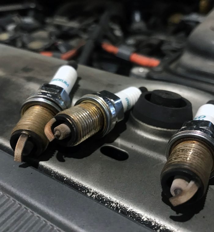 Tune ups used to involve replacing parts, such as spark plugs, spark plug wires, and the distributor cap and rotor. Mechanics would change the air filter and fuel filter, replace points in the condenser – if the car was old enough – and even perform an oil change, depending on the time frame. It could also consist of adjusting the distributor to change the timing, cleaning the throttle plate and the choke on the carburetor, and making air fuel adjustments, including setting the base idol. Through the years, as vehicles have become more advanced with fuel injections and computers, what is considered a tune up has changed. Changing the spark plugs is one service that continues to be offered. However, the mileage between spark plugs has gone from 30,000 miles to between 60,000 and 105,000 miles in most vehicles today. This increase is due to the ignition systems being Coil on Plug (COP) and the materials that the spark plugs are made out of, such as iridium and platinum, lasting much longer. Of course there’s still air filters, but a lot of the time the fuel filters are integral with the fuel pumps in the gas tanks, depending on the vehicle.  One service that helps greatly with today’s vehicles is cleaning the throttle body and doing an induction service. The way the PCV systems are made, more carbon gets built up in the intake and the valves than it used to. While you’re driving, computers take care of a lot of adjustments you used to have to make. However, it’s more important than ever to maintain your vehicle or to do the tune up at the interval, even if your vehicle is running just fine. Computers will try to compensate for a problem that an automotive technician could catch during the regular tune up. It is more important than ever to use the correct type of spark plugs for your car or truck. While a cheaper spark plug may technically allow your vehicle to run, you could be asking for the check engine to turn on for weird issues and possible damage to your engine. The way vehicles are designed nowadays, it could be very difficult to get to the spark plugs. You used to be able to work on them in your driveway, but today it could take four or five hours to reach them, depending on what you have to take off to get to them. SHOP TIP: Because some spark plugs are very hard to get to, when you go in for a tune up, ask to see your spark plugs. Unfortunately, when working with other shops, we have seen that the front three have been changed but not the three in the back. Steve’s Auto Repair & Tire is an authorized Goodyear tire dealer located in Woodbridge, Virginia. Automotive repair services are performed on all makes and models, including BMW and Mercedes. Services include oil changes, brakes, alignments, inspections, and computer engine diagnostics.